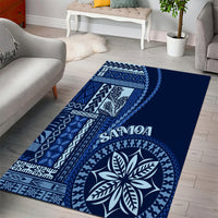 Blue area rug with geometric bands, Samoa text, and leaf medallion