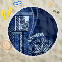 Round beach blanket in blue and white with white fringe and Siapo motif pattern