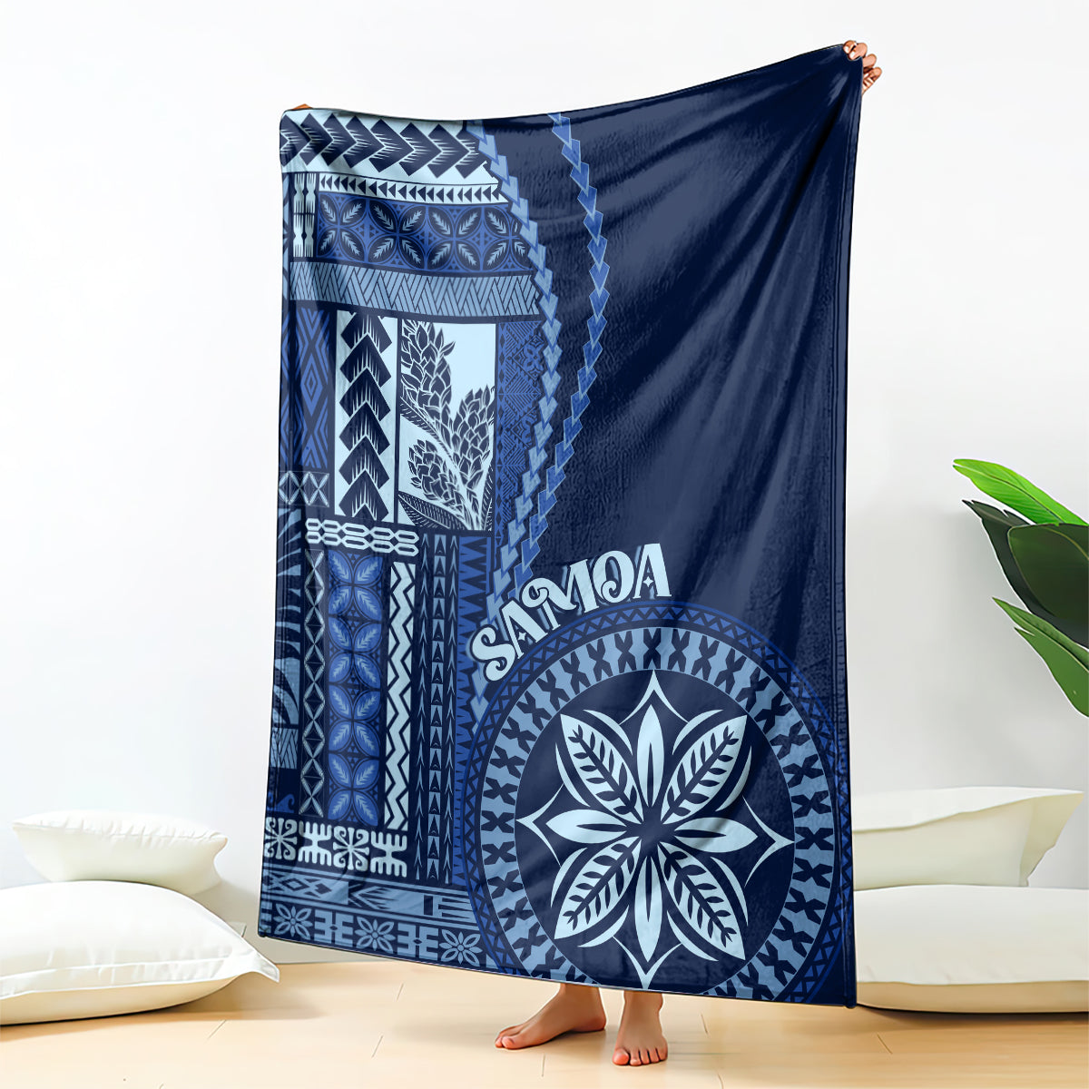 Blue Samoa siapo motif blanket with geometric border and large circular emblem