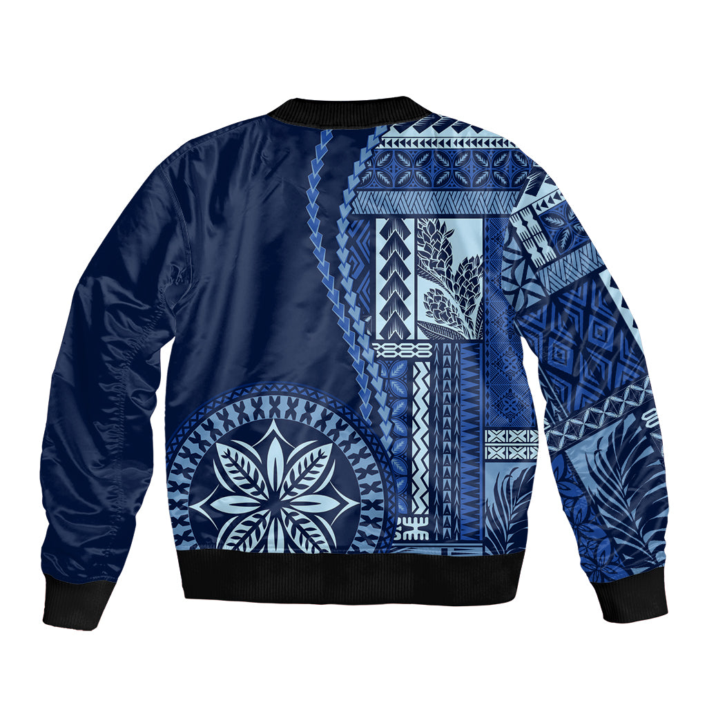 Unisex blue bomber jacket with large white floral and geometric patchwork, black ribbed hem