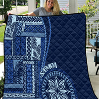 Navy blue quilt with Samoa siapo patchwork motifs and large round floral medallion