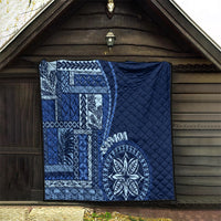 Navy blue quilt with Samoa siapo geometric panel and round floral medallion, quilted fill