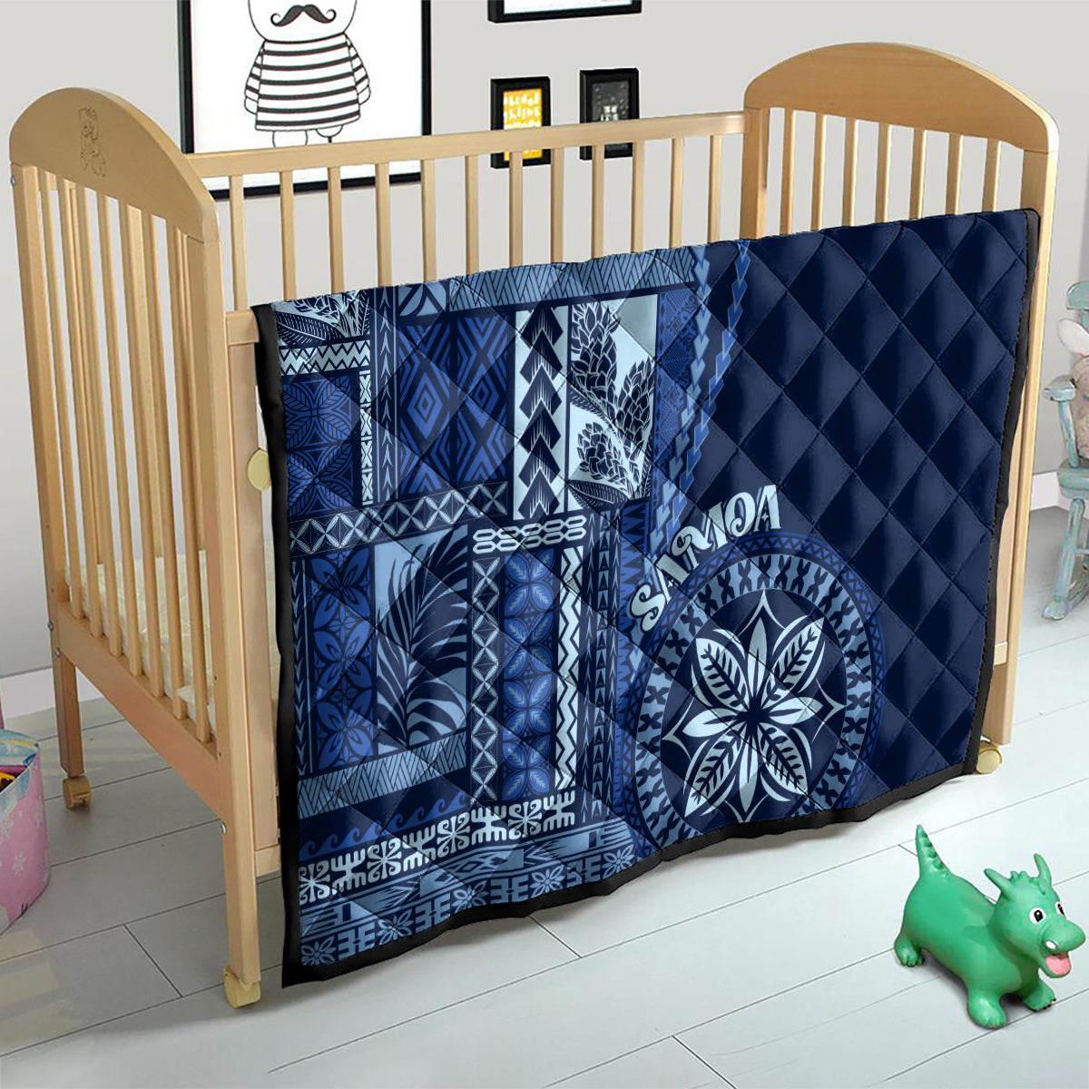 Navy blue baby quilt with Samoa siapo geometric panel and round floral medallion