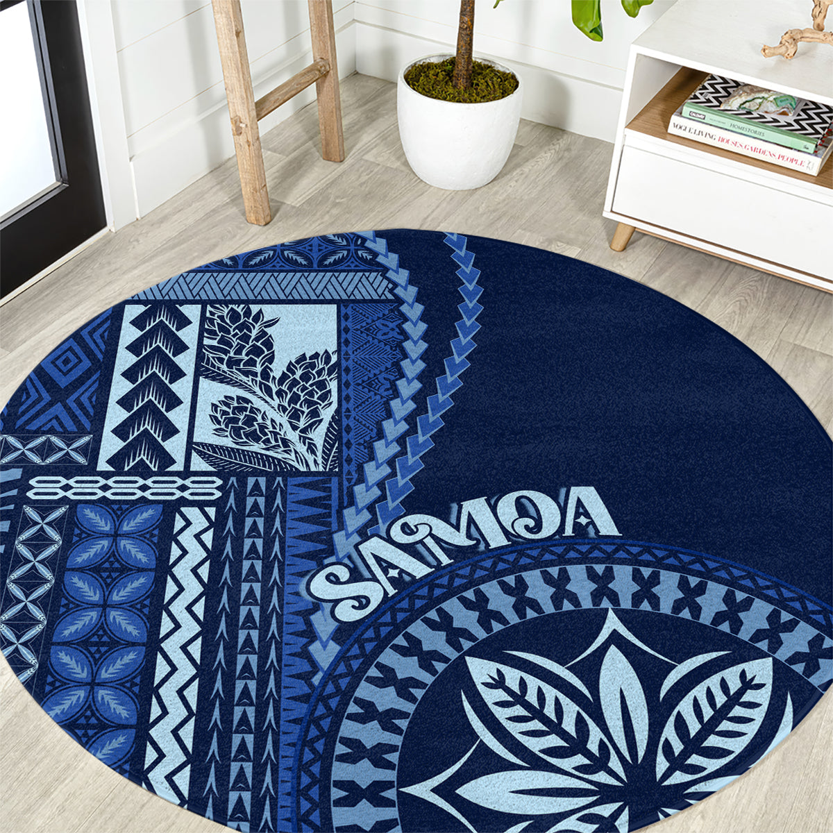 Round blue rug with white Samoa siapo patterns and leaf emblem, “Samoa” text
