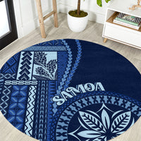 Round blue rug with white Samoa siapo patterns and leaf emblem, “Samoa” text