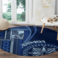 Round blue rug with white geometric panel and large leaf emblem, “Samoa” text