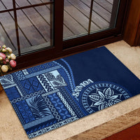 Blue rubber doormat with white siapo motif squares and round leaf design, rectangular