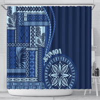 Blue shower curtain featuring large circular leaf emblem and geometric border on left