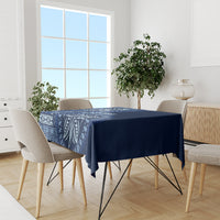 Blue tablecloth with white island-inspired motif print on dining table and chairs