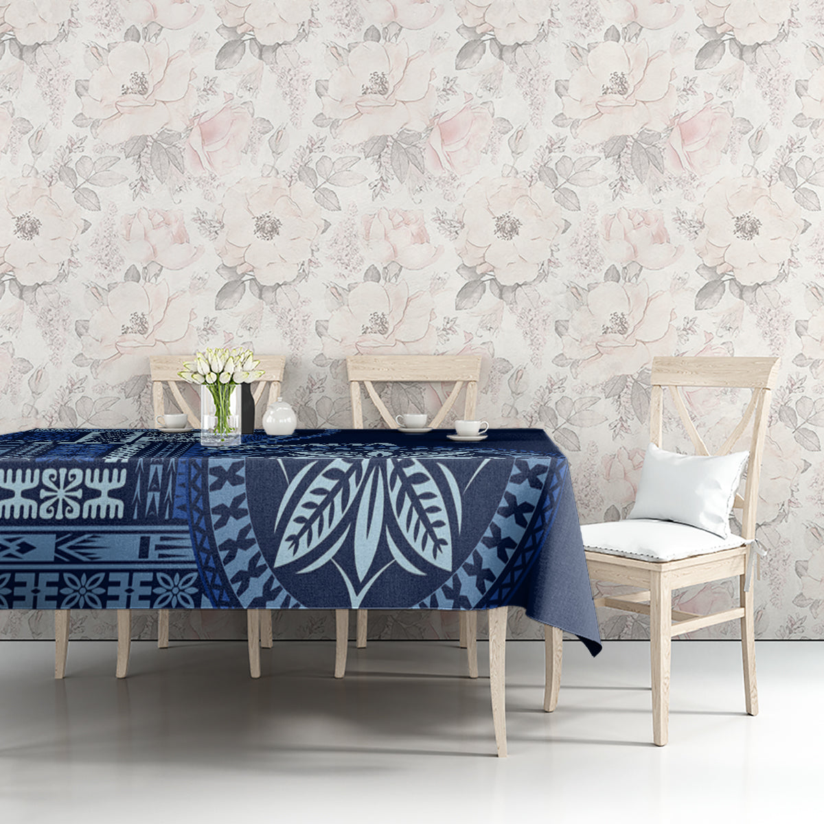 Blue patterned tablecloth with leaf and geometric elements on a dining side table