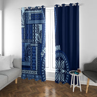 Blue window curtains with geometric siapo motifs on left and solid dark-blue right panel