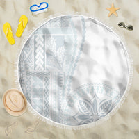 Round beach blanket in white with light blue geometric and leaf pattern, fringed edge