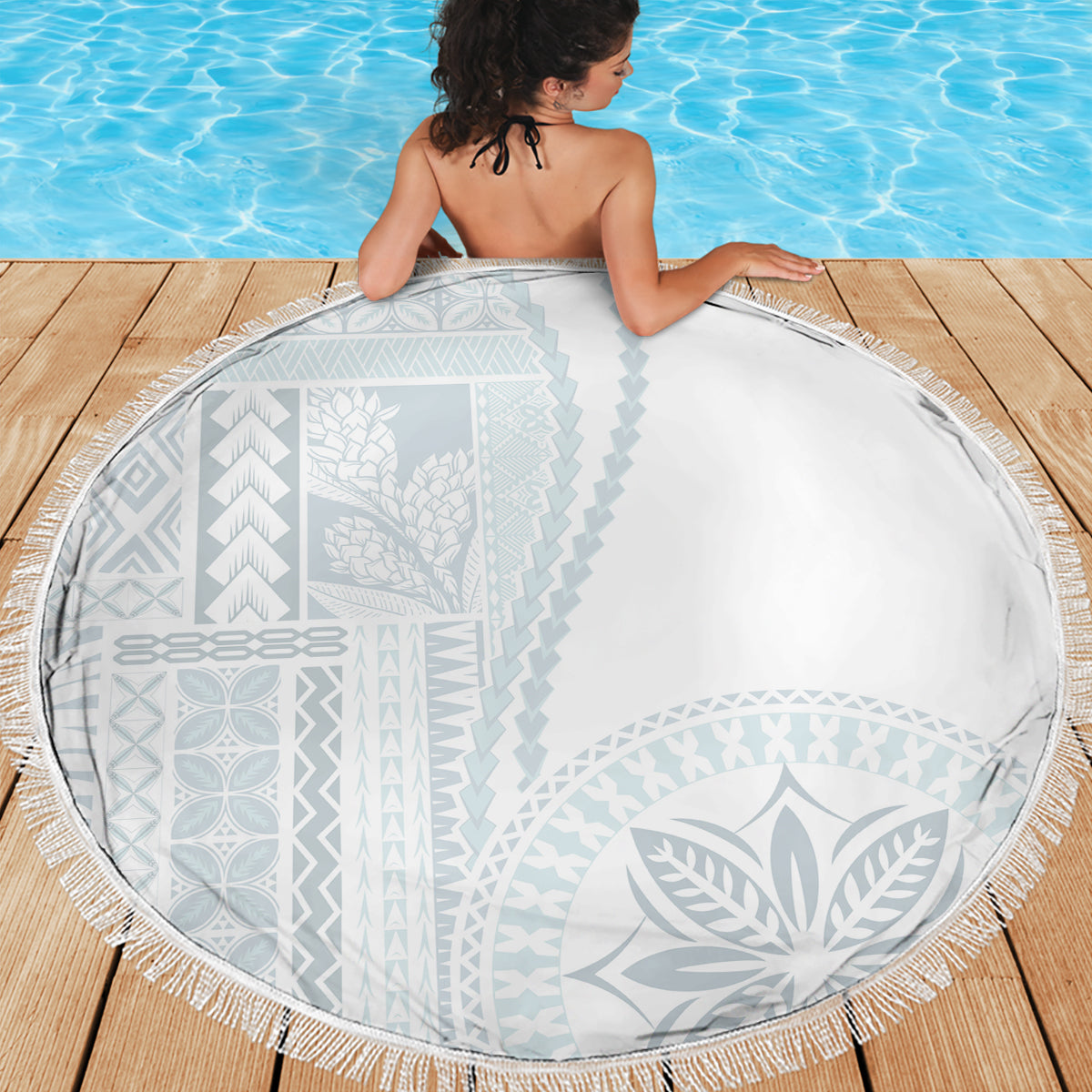 Round white and light blue patterned beach blanket with fringe trim