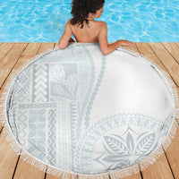 Round white and light blue patterned beach blanket with fringe trim