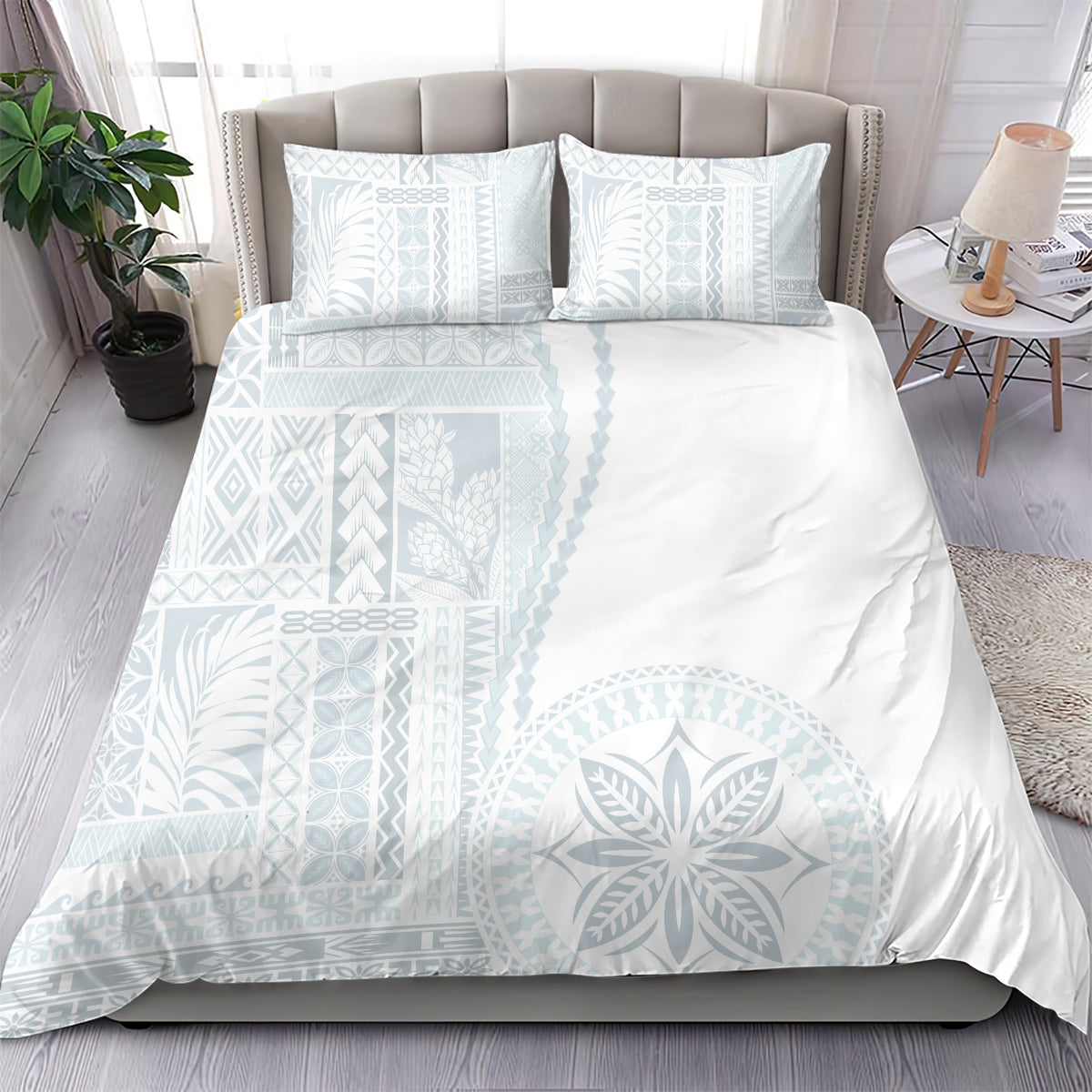 White duvet set with light-blue geometric and leaf siapo motifs, plus two pillowcases