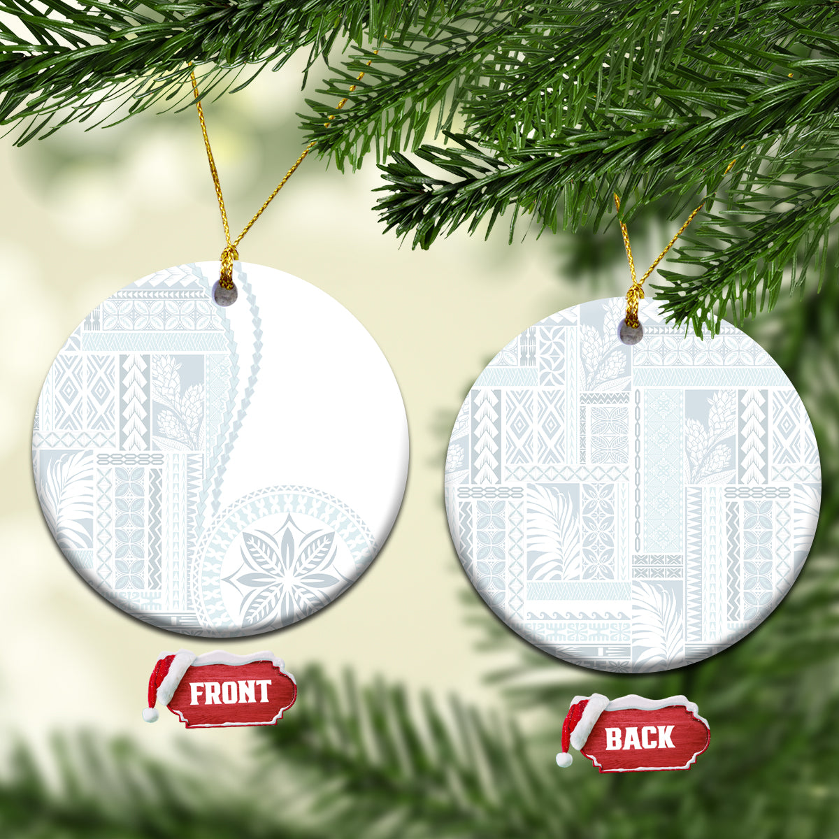 White ceramic round ornament with blue patterned siapo design, hanging on gold cord.