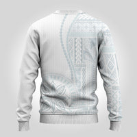 White back of crewneck sweater with light blue vertical geometric print, ribbed hem.