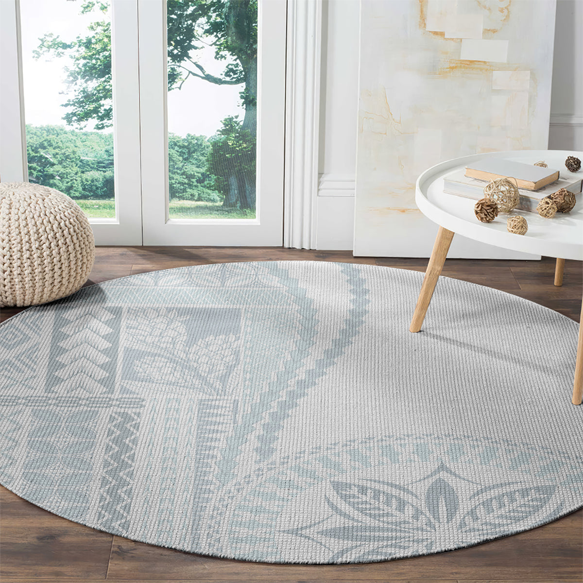 Round light-gray carpet with blue geometric panel and leaf motif detail