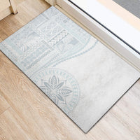 Rectangular white rubber doormat with light blue geometric and leaf print