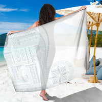 White sarong with light gray siapo-style geometric and floral pattern panel, draped.