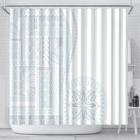 White shower curtain with light blue geometric panels and large leaf fan medallion, grommet top