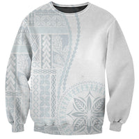 White sweatshirt with light-blue Siapo-style geometric print, crew neck, long sleeves.