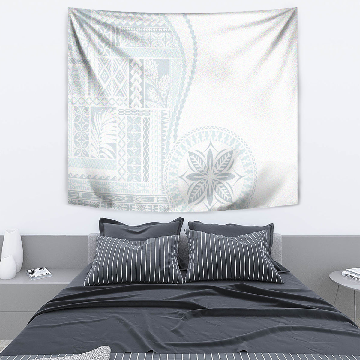 White siapo-style tapestry featuring light blue woven patterns and a large circular motif