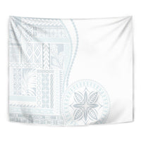 White siapo-style tapestry close-up with light blue geometric and rosette designs