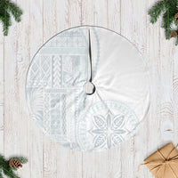 White and light-blue circular tree skirt with siapo-style motifs and center tie opening.