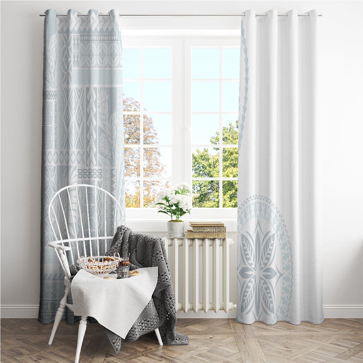 White curtains with light blue siapo-style bands and a large leaf motif on the side panels
