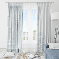 White and light blue siapo-style window curtains with patterned left panel and solid pleats