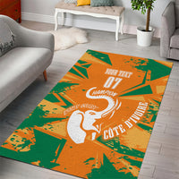 Orange and green rectangular area rug featuring a white elephant and bold champion lettering