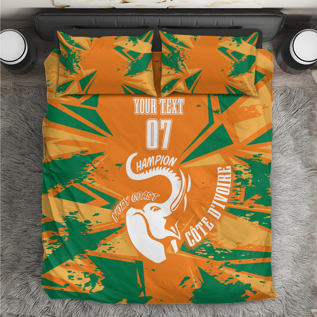 Orange and green geometric bedding set featuring an elephant silhouette and two pillows