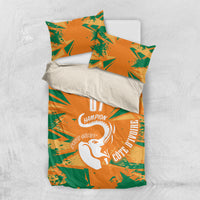 Orange and green geometric duvet with elephant emblem and two coordinating pillowcases