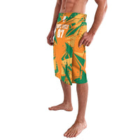 Orange and green custom football lavalava with abstract print and 'YOUR TEXT 07' front panel