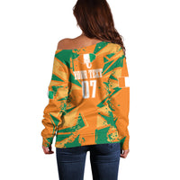 Orange off-shoulder sweater back with custom text area and large 07 print, women’s fit