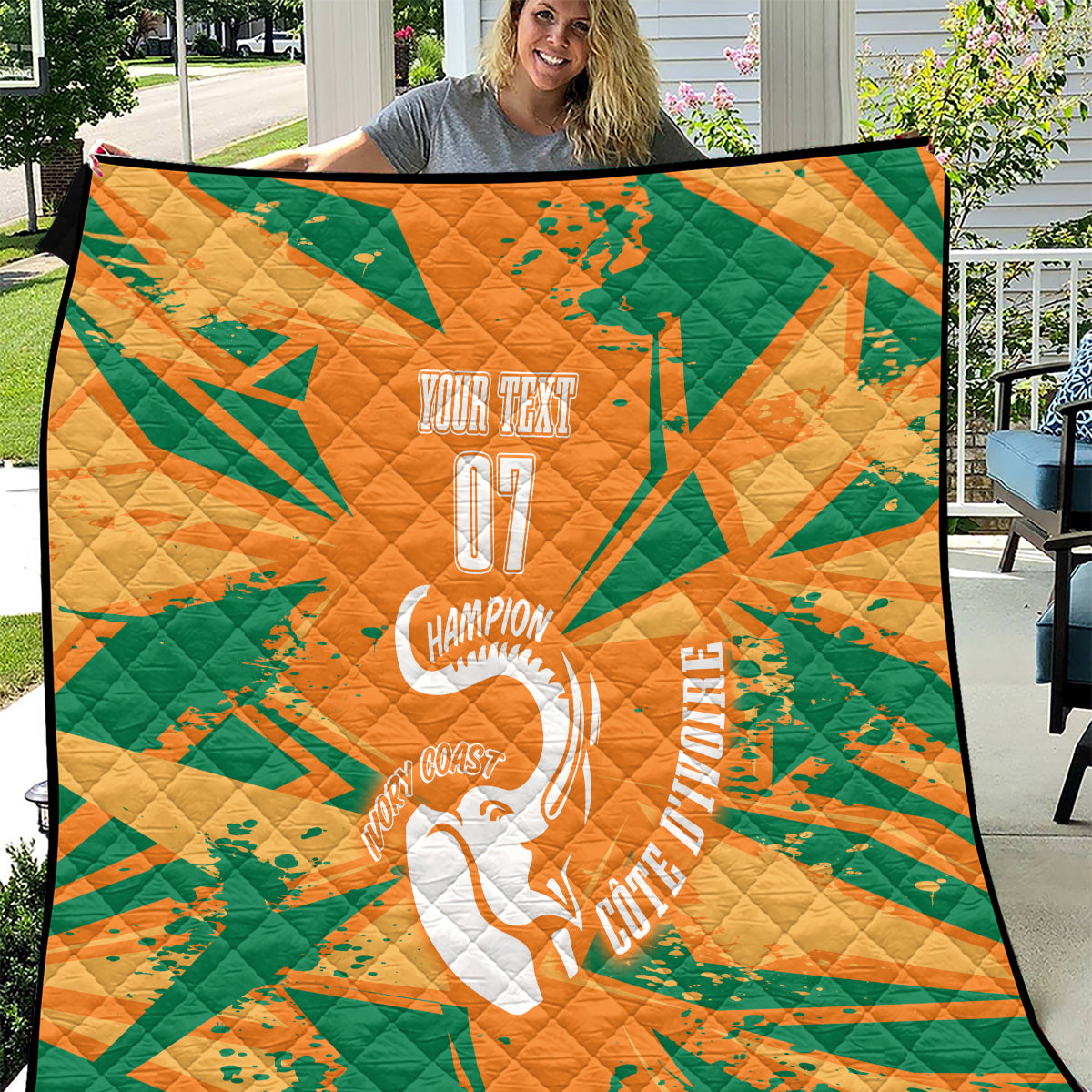 Orange and green quilt with geometric pattern, elephant emblem, and “Your Team 07” text