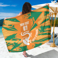 Orange and green elephant graphic sarong, wrap-style with custom text and logo.