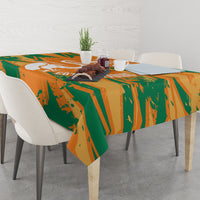 Orange and green elephant graphic custom tablecloth on a dining table