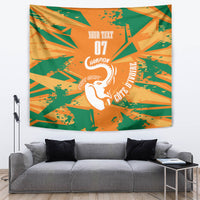 Custom football tapestry with orange and green geometric print and white elephant champion text