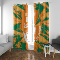 Orange and green custom window curtain panels with elephant logo and scattered paint marks