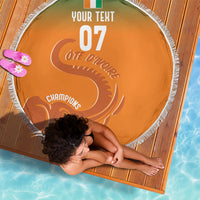 Orange round beach blanket with white fringe, elephant silhouette and 'Champions' text