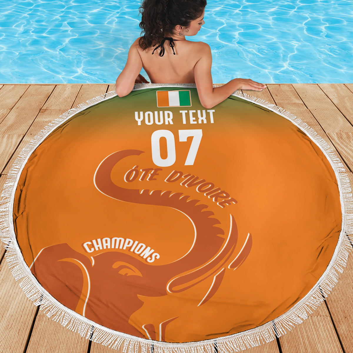 Orange round beach blanket with white fringe, custom '07' and elephant graphic