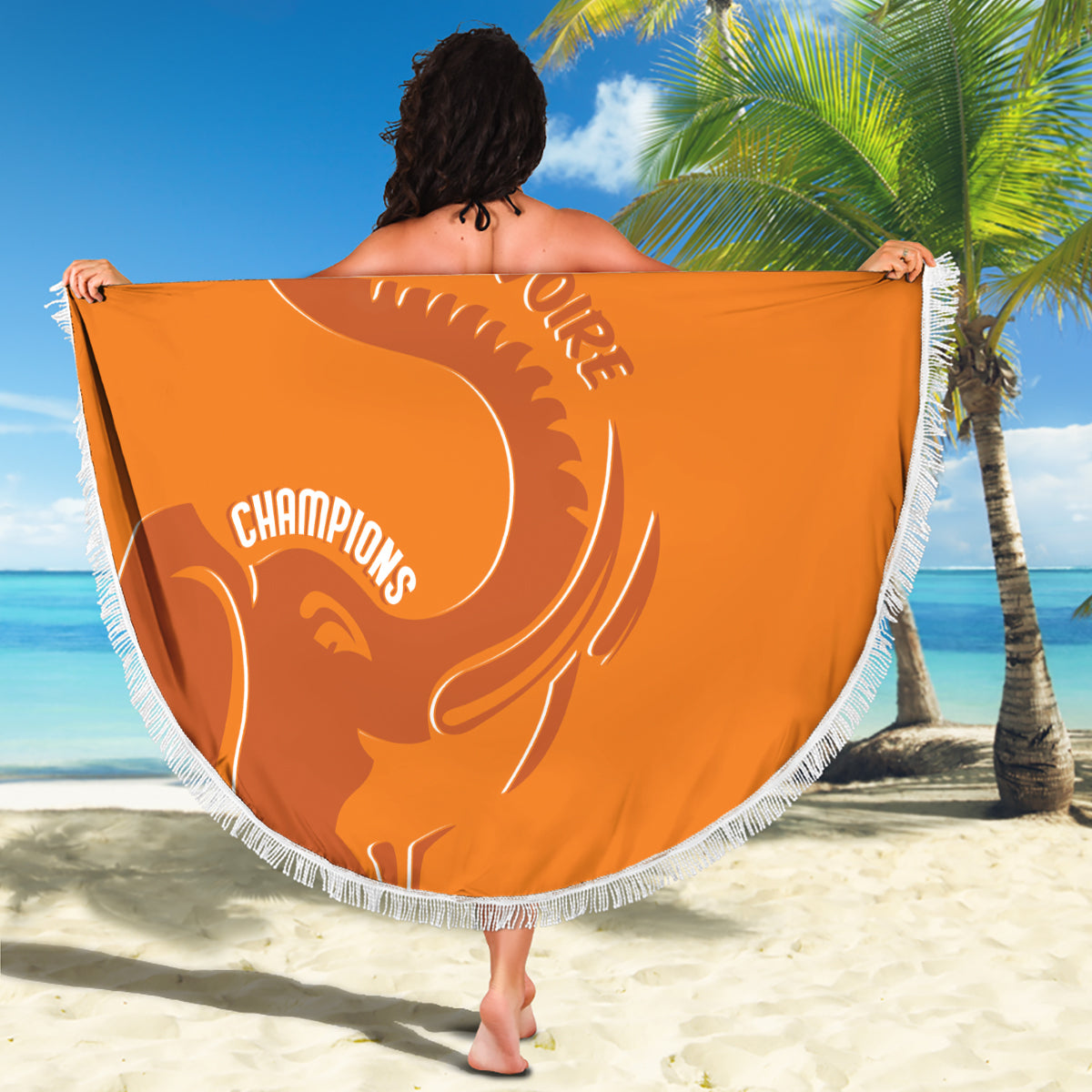 Orange round beach blanket with white fringe, 'Champions' and elephant silhouette