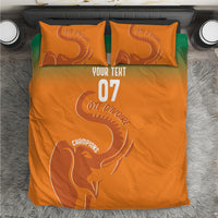 Orange custom bedding set with elephant graphic and “YOUR TEXT” and “07”