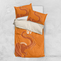 Orange bedding set with elephant print, “YOUR TEXT,” and “07” on the duvet