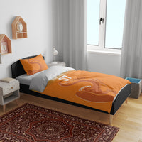 Orange bedding set with elephant illustration and “YOUR TEXT 07” text layout