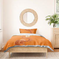 Orange duvet and pillow set with elephant graphic, “YOUR TEXT,” and “07”