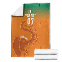 Folded custom football blanket, orange-to-green gradient with elephant and Champions text