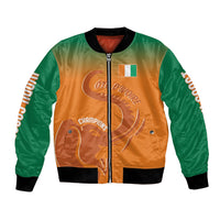 Orange and green varsity bomber jacket with black ribbed collar, zip front, flag patch